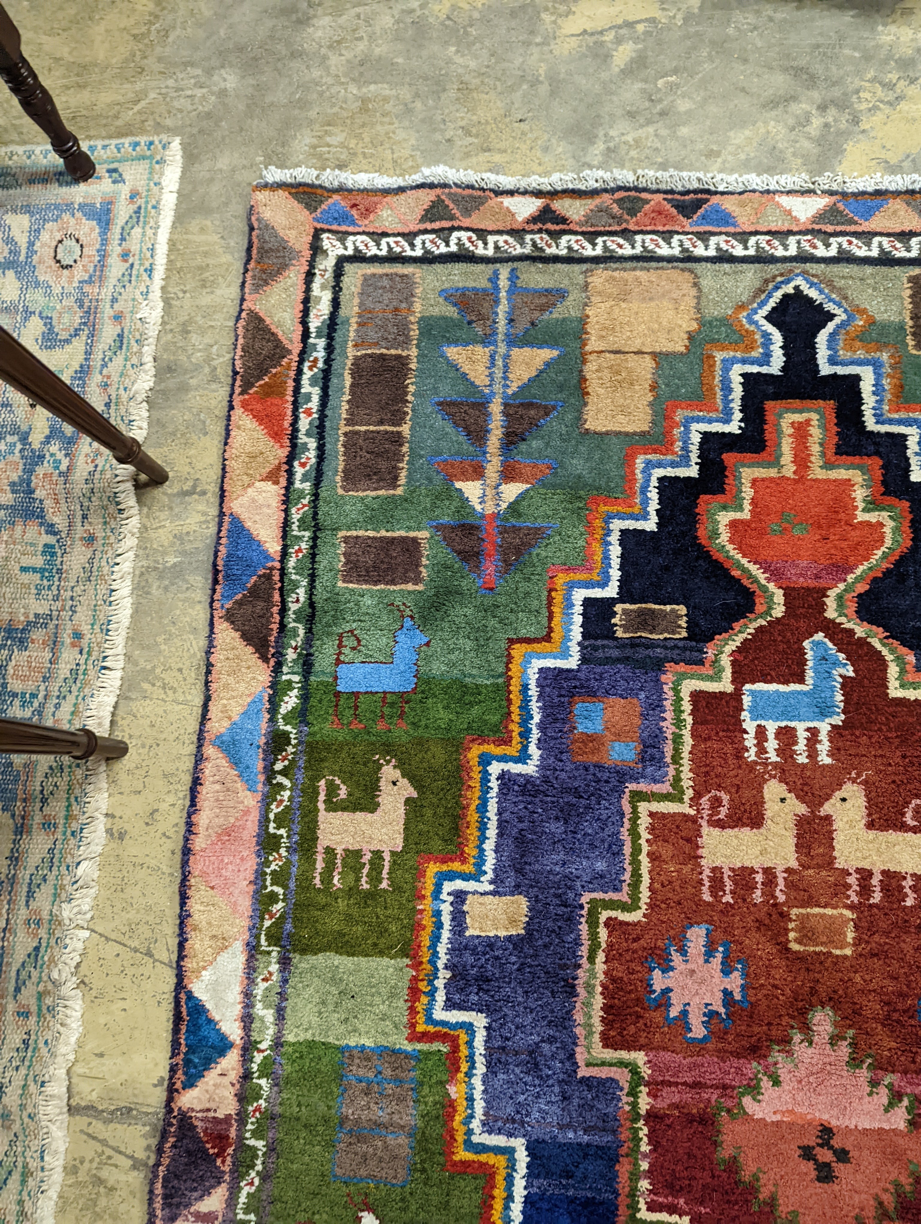 A Caucasian design blue ground rug, 180 x 128cm